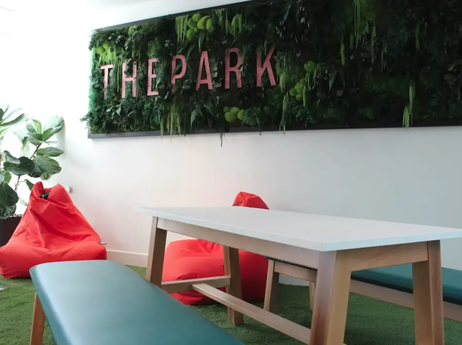 Lobby with a fun green inspired sign.